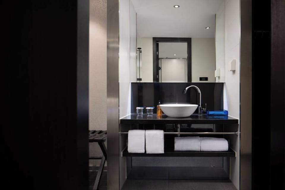 Shower, rainfall showerhead, hair dryer, towels