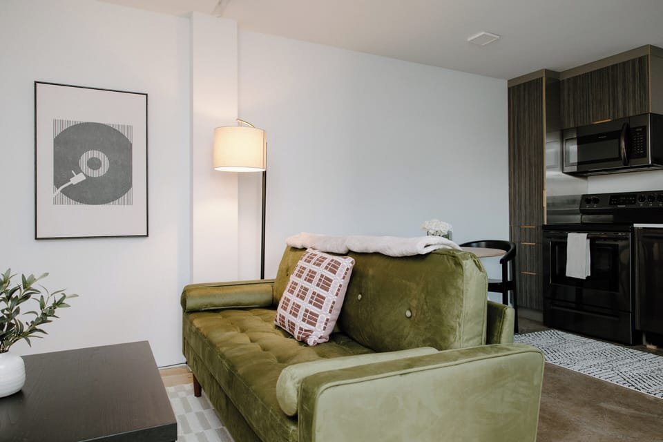 Relax in a thoughtfully designed living space featuring a Roku TV with streaming services, high‑speed 500mbs AT&T Fiber Wi‑Fi, and a comfortable layout perfect for work or leisure