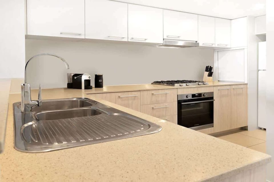 Full kitchen with plenty of bench space & essentials for real cooking, and storage for extended stays.