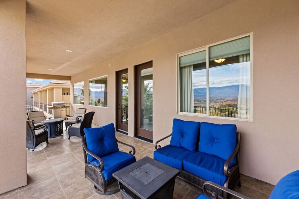 Enjoy two separate seating areas about fire tables on the top balcony.