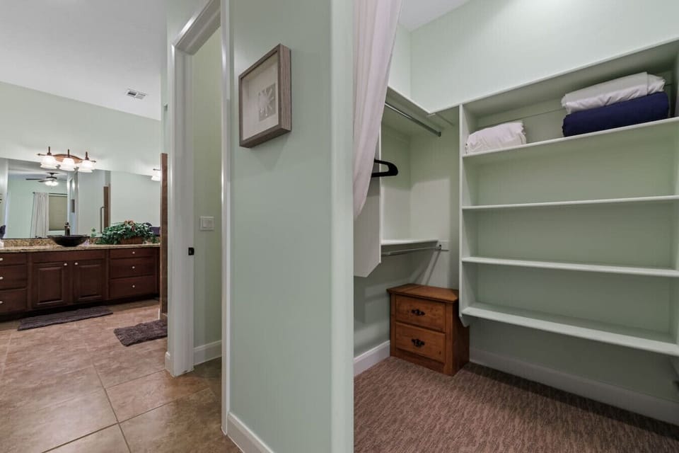Primary bedroom en suite with large walk in-closet.
