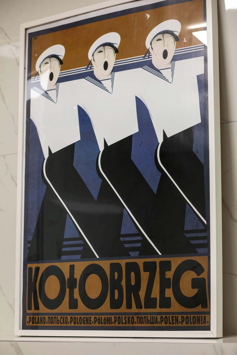 A close-up of a stylish Kołobrzeg art poster, adding a decorative touch to the interior.