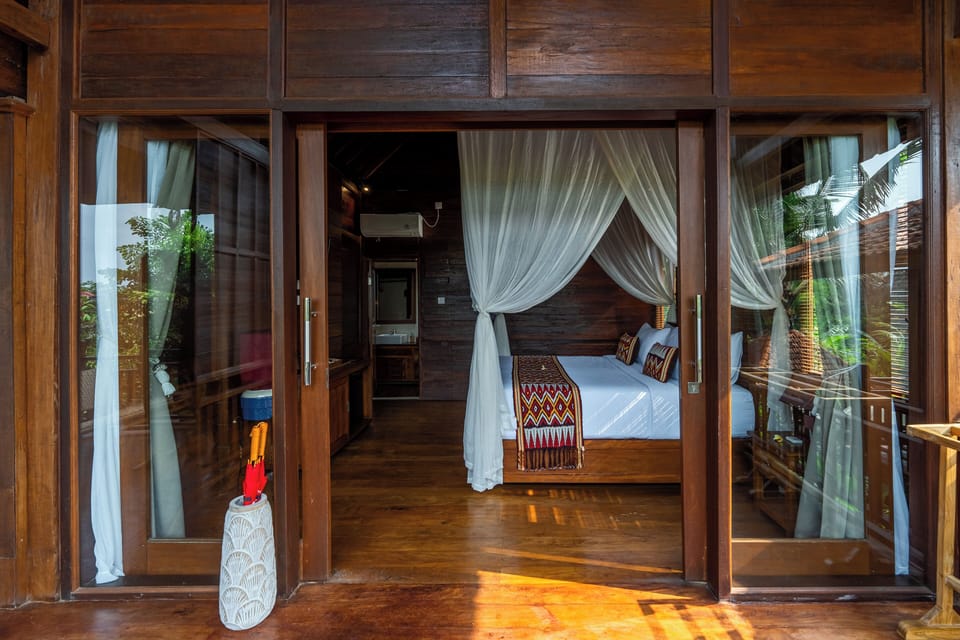 Deluxe Double Room, Balcony, Pool View | Minibar, in-room safe, iron/ironing board, free WiFi