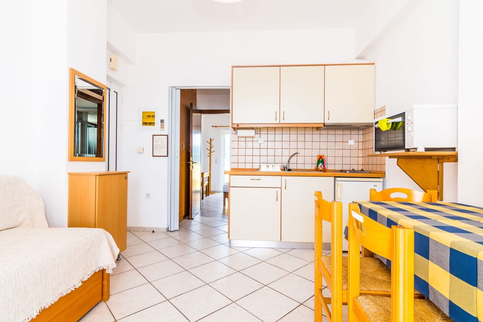 One-Bedroom Apartment - First Floor | Living area | Plasma TV, DVD player