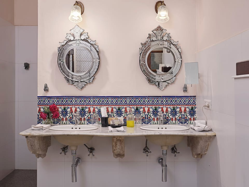 Deluxe Suite, Balcony, Courtyard View | Bathroom | Free toiletries, bathrobes, slippers, soap