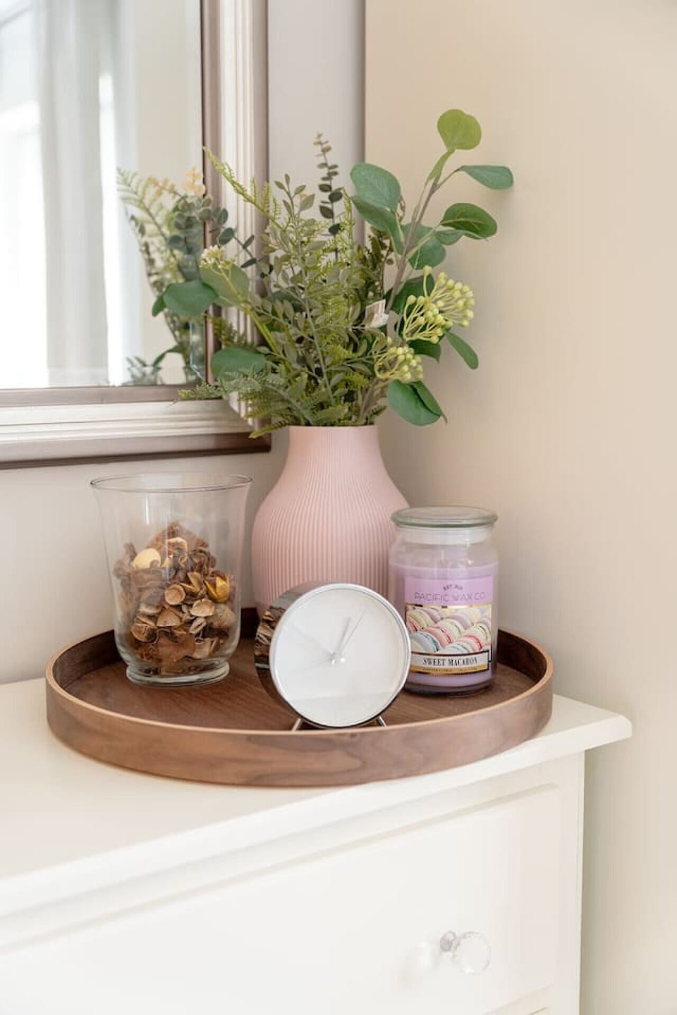 Use the dresser top for small items with a tray, vase, and candle display