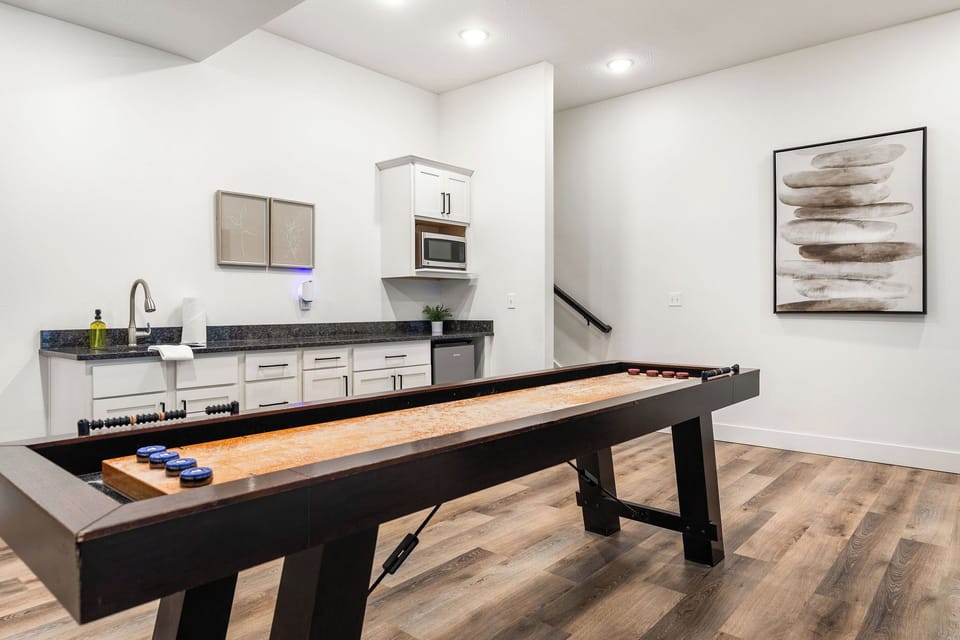 shuffleboard next to the mini fridge and microwave downstairs!