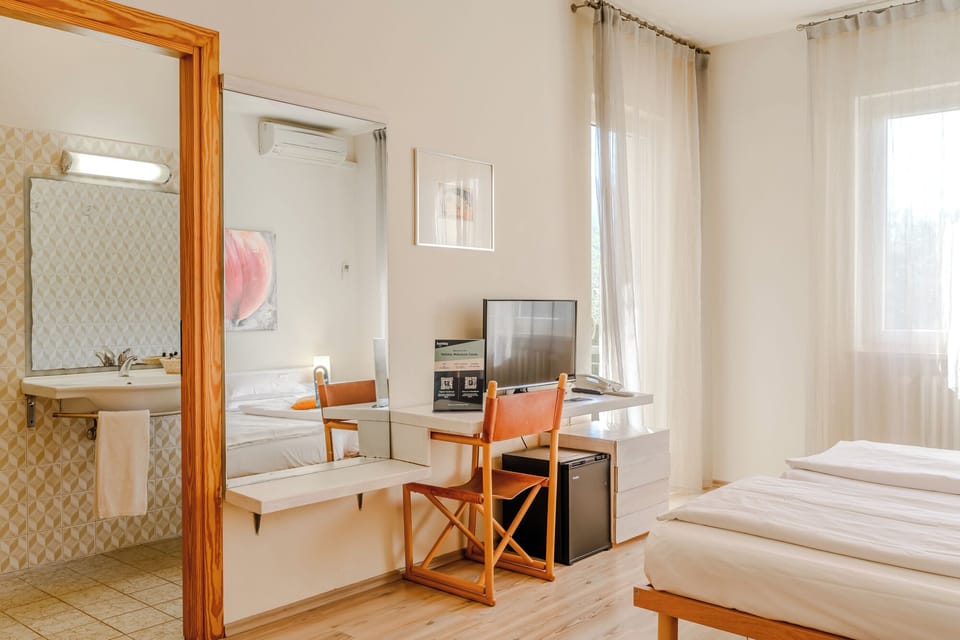 Standard Triple Room, Balcony | In-room safe, desk, free WiFi