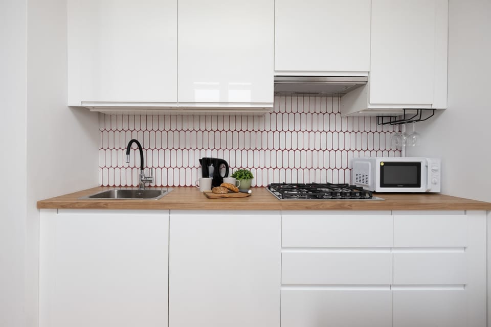 The fully equipped kitchenette includes everything you need for a home-cooked meal.
