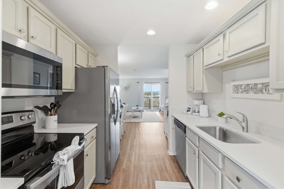 The breezy kitchen is well equipped for an unforgettable getaway​