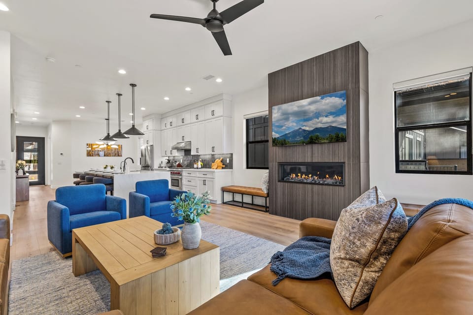 Spacious great room with fireplace, vaulted ceilings & natural light
