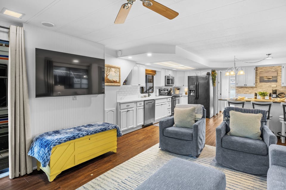 Spacious salon with lots of room for lounging, cooking, dining, and socializing.