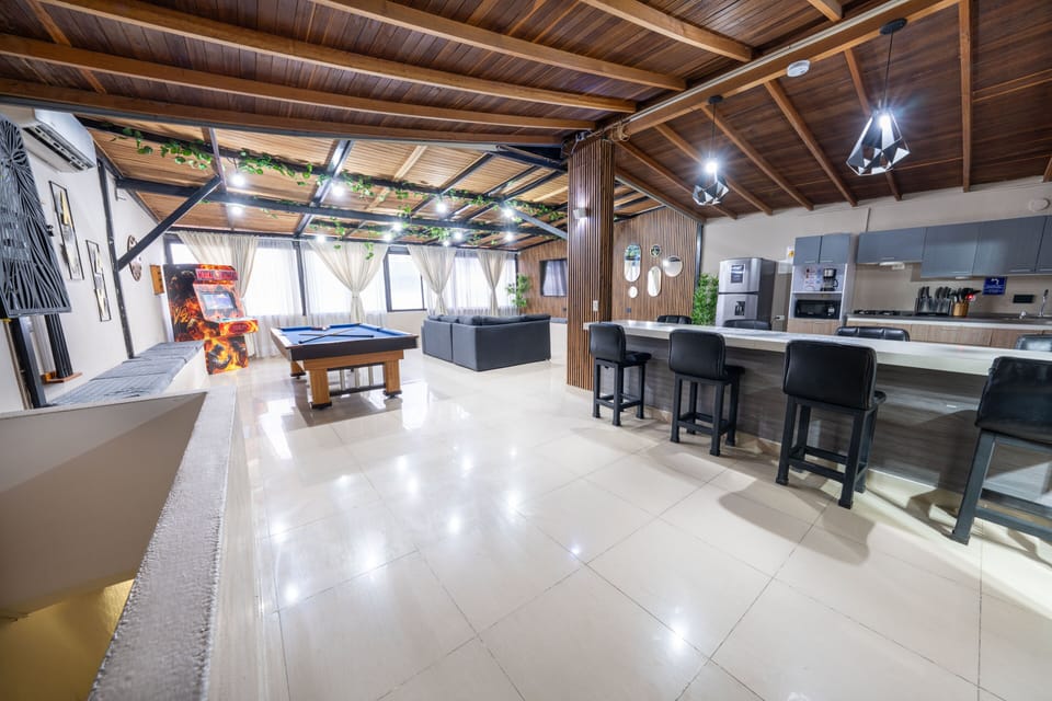 Apartment | Living area | 79-inch flat-screen TV with digital channels, video-game console