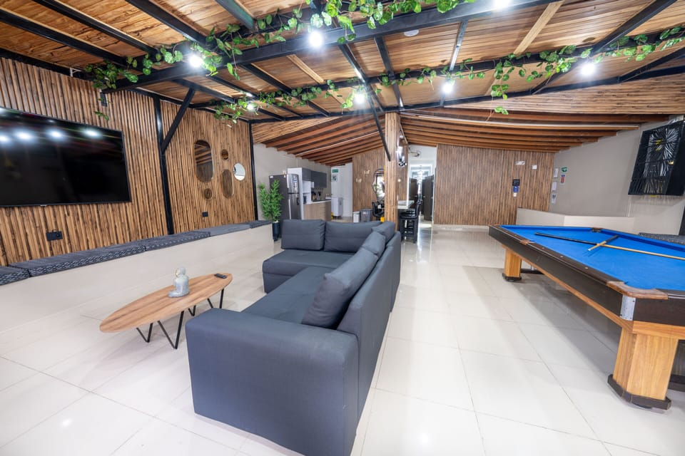 Apartment | Living area | 79-inch flat-screen TV with digital channels, video-game console