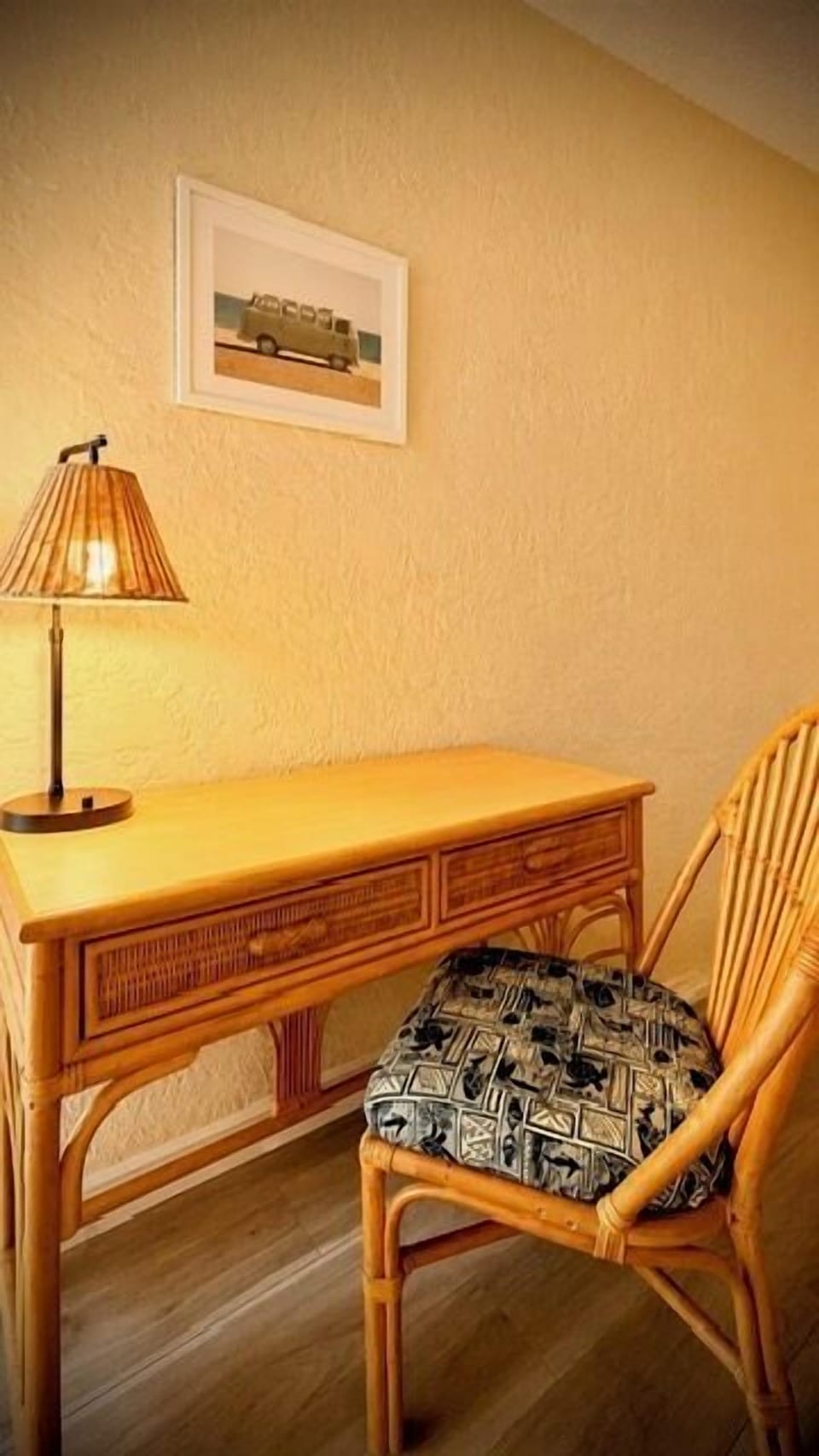 Your private workspace features warm wicker furniture and soft lighting, creating a cozy corner for planning your next adventure or catching up on work.