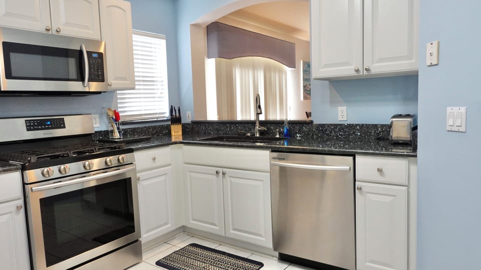 Your fully equipped kitchen features granite countertops, stainless steel appliances, and everything you need to create delicious meals during your stay.