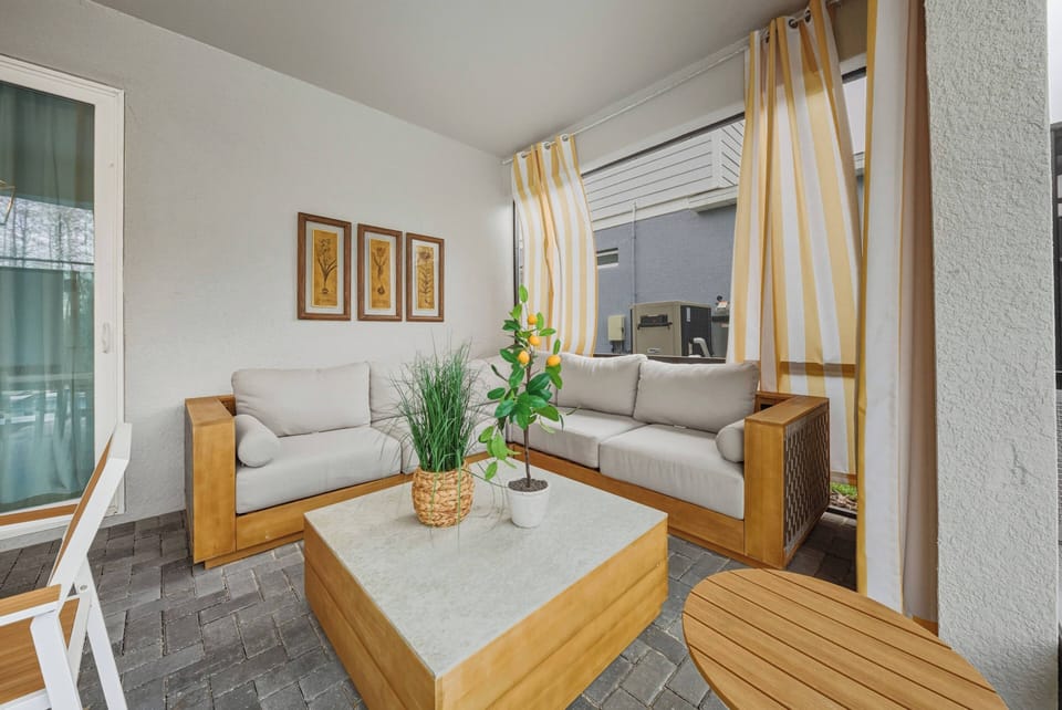 Step into a cozy space where soft light filters through sheer curtains, highlighting natural wood accents. The earthy tones and greenery create a refreshing atmosphere that's perfect for relaxation and unwinding.