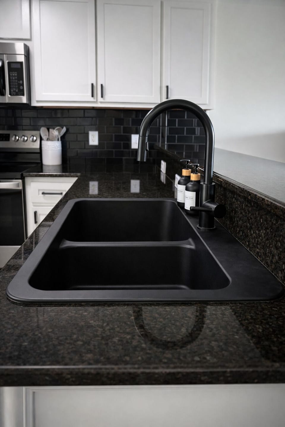 Modern kitchen with deep sink, stainless fixtures, and stocked essentials.