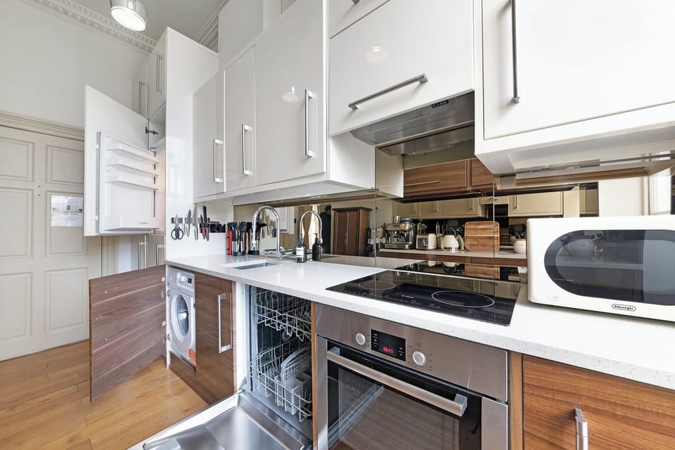 Fully equipped kitchen: fridge, freezer, washing machine, airer, iron and ironing board, dishwasher, oven and induction hob, microwave, electric kettle, toaster and barista-style coffee maker
