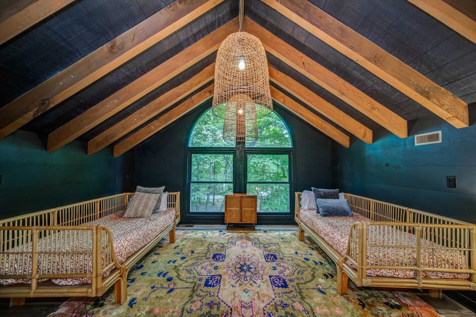 Spiral Staircase leads to the loft where you can kick back and relax on one of the daybeds in the 2nd level loft