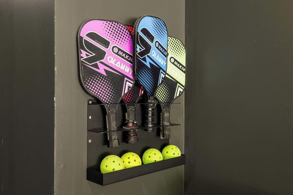 Pickleball equipment is stocked and ready — paddles and balls included, with a dedicated court in the garage for year-round play at your Pocono vacation rental.