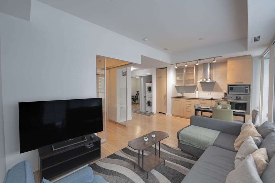 Deluxe Double Room, Balcony, City View | Living area | 60-inch LED TV with cable channels
