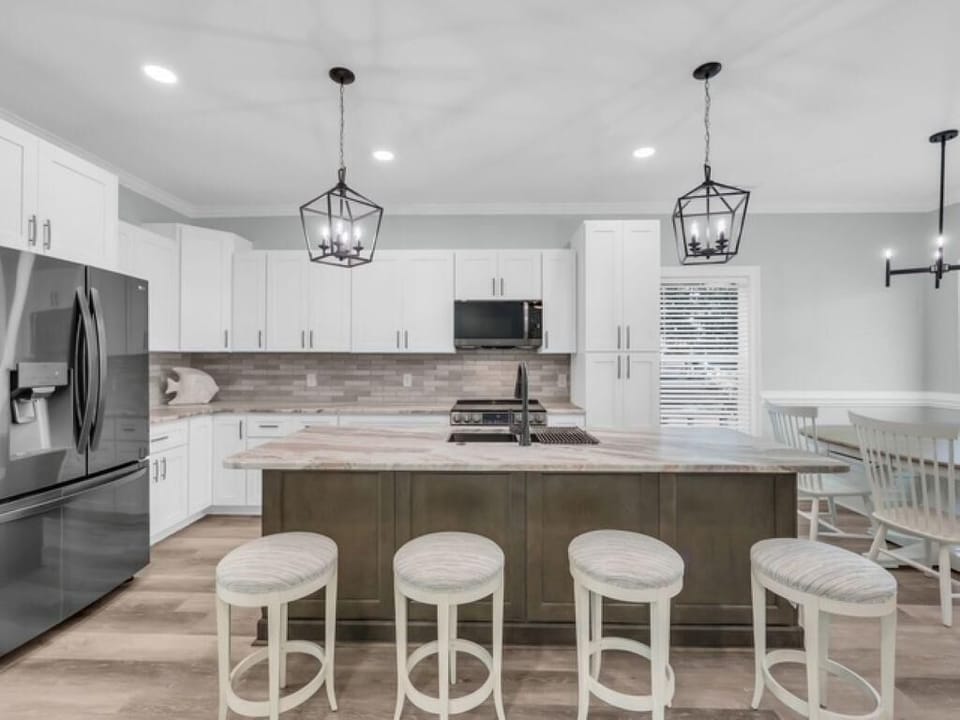 Spacious kitchen with modern island seating for gatherings