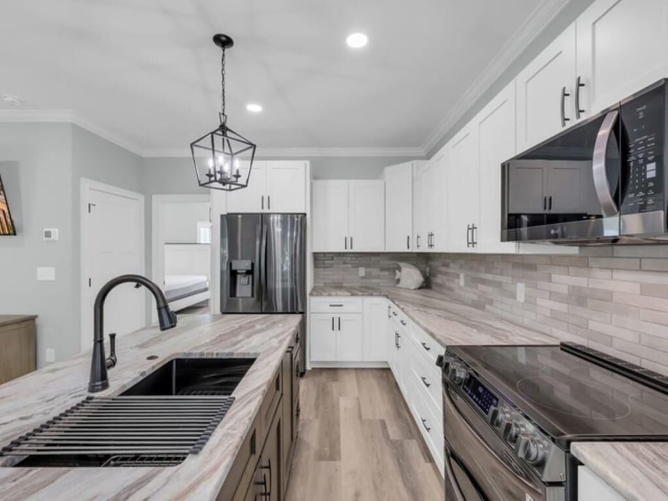Modern kitchen with sleek appliances and spacious countertops