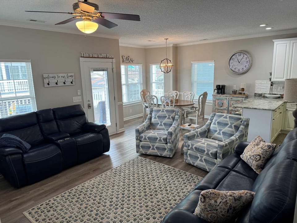 Bright and cozy living room with ample seating and natural light