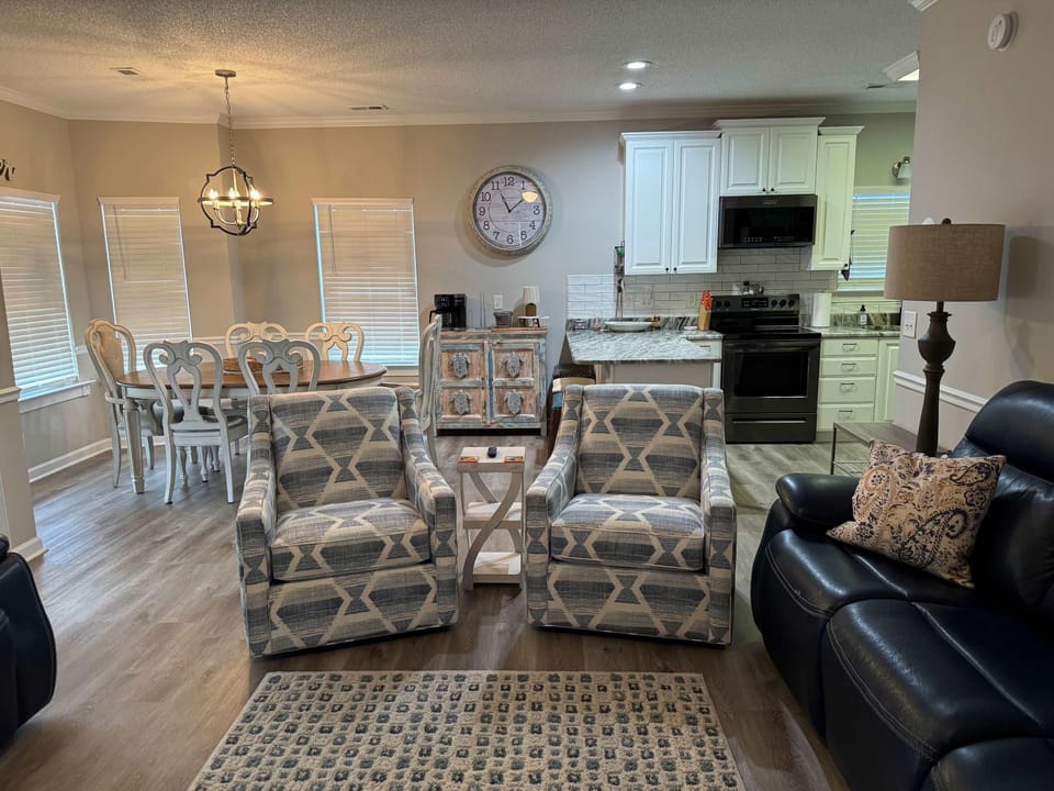 Cozy living and dining area with stylish, comfortable seating