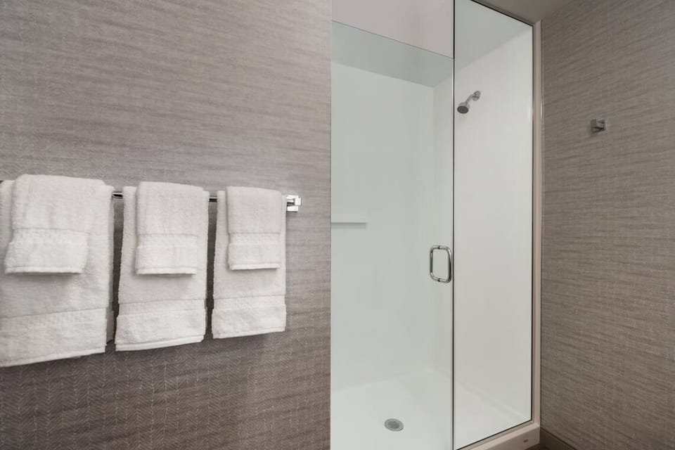 Rinse off in a spotless glass shower with spa-like calm.