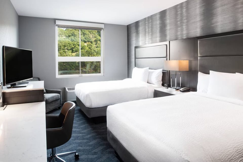 Stretch out comfortably in a spacious double-queen room setup.