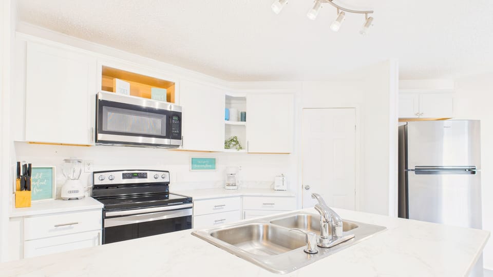 Kitchen with island and breakfast bar seating