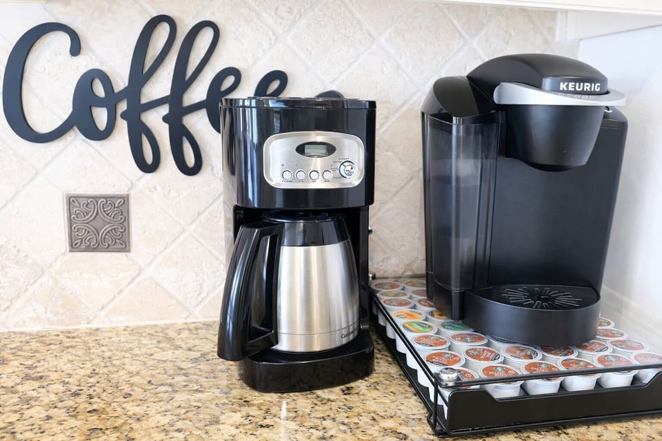 Keurig and coffee pot (tea kettle is on the stove)
