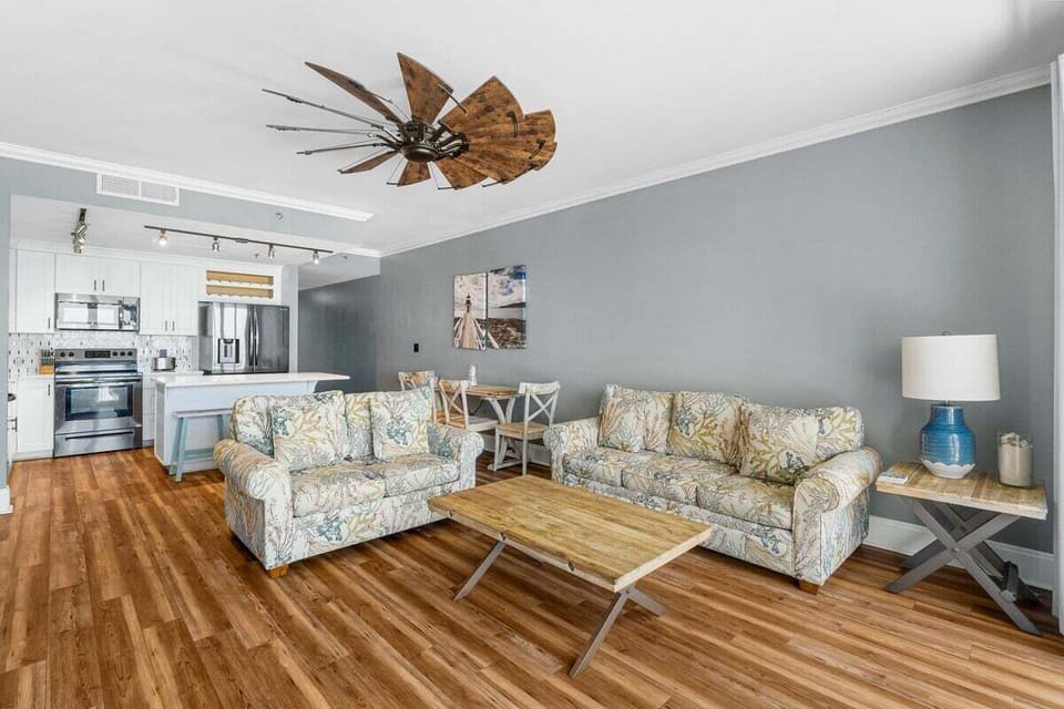 Living area with ample seating and coastal decor