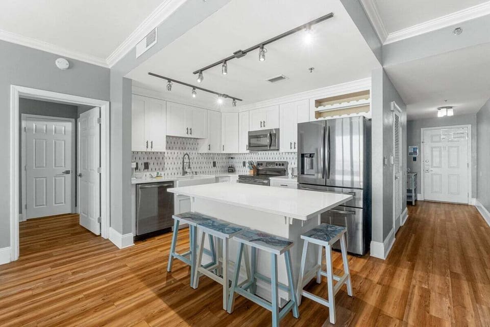 Full kitchen with island and breakfast bar