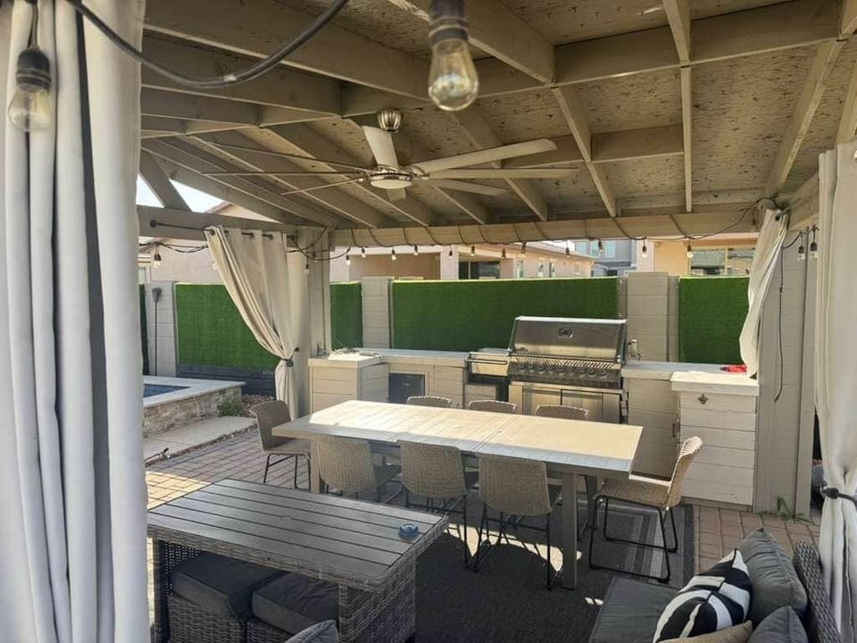 Gazebo with BBQ with outdoor seating 