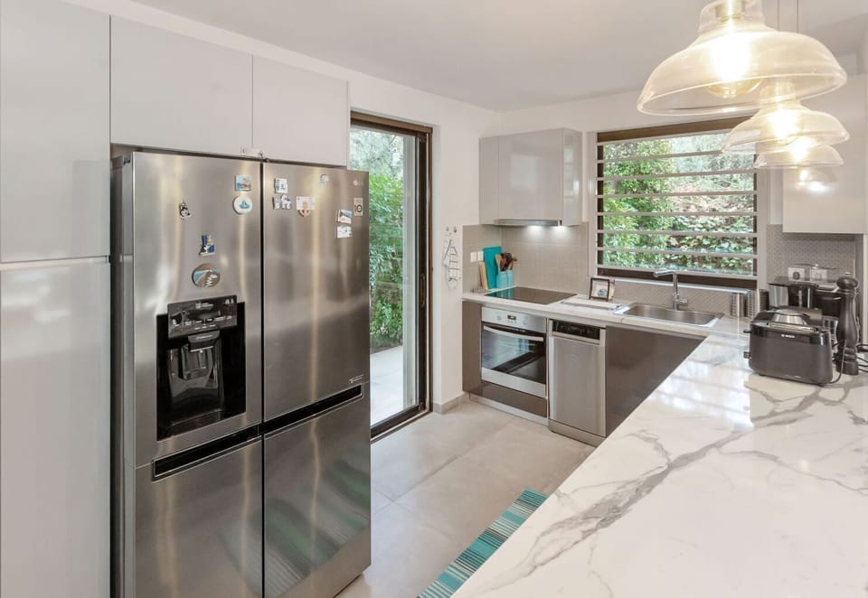 Family Apartment, Garden View | Private kitchen | Full-size fridge, microwave, oven, stovetop