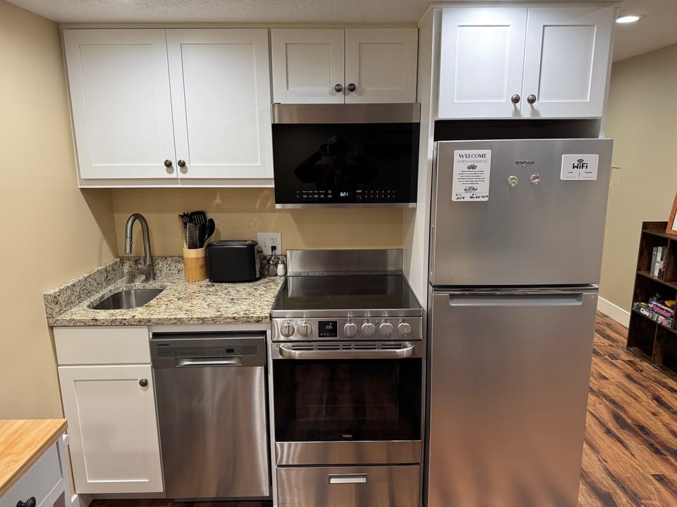 Stainless steel appliances. Microwave, dishwasher, oven and refrigerator.