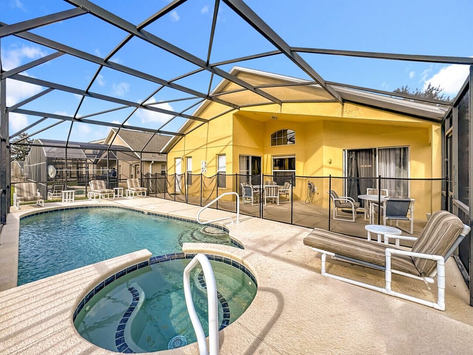 Private screened pool and patio with outdoor seating—perfect for relaxing year-round.
