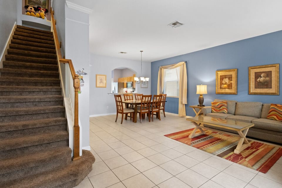Open living and dining area with spacious seating and natural light