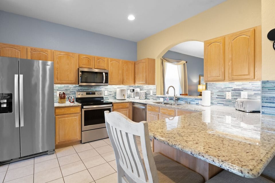 Modern kitchen with breakfast bar and updated appliances