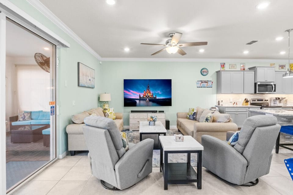 Bright living room with TV and comfortable seating