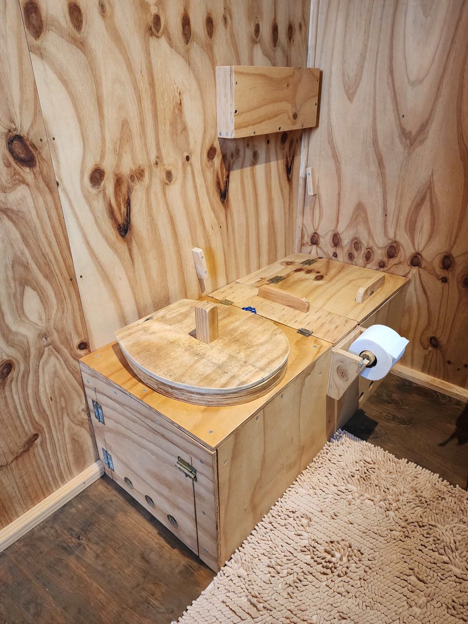 Natural wood sink basin set against beautifully grained walls.