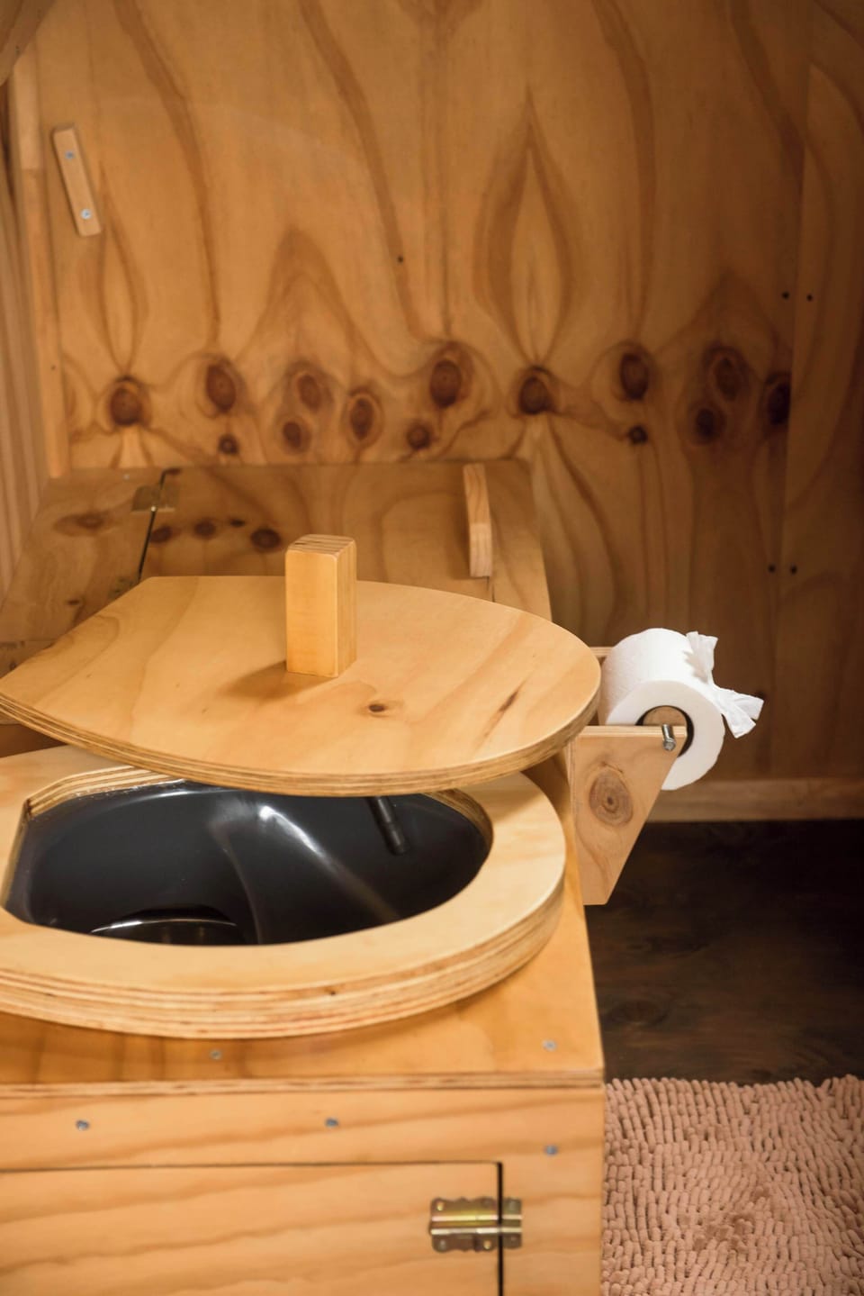 Rustic bathroom vanity w/ bowl sink & wood countertop.