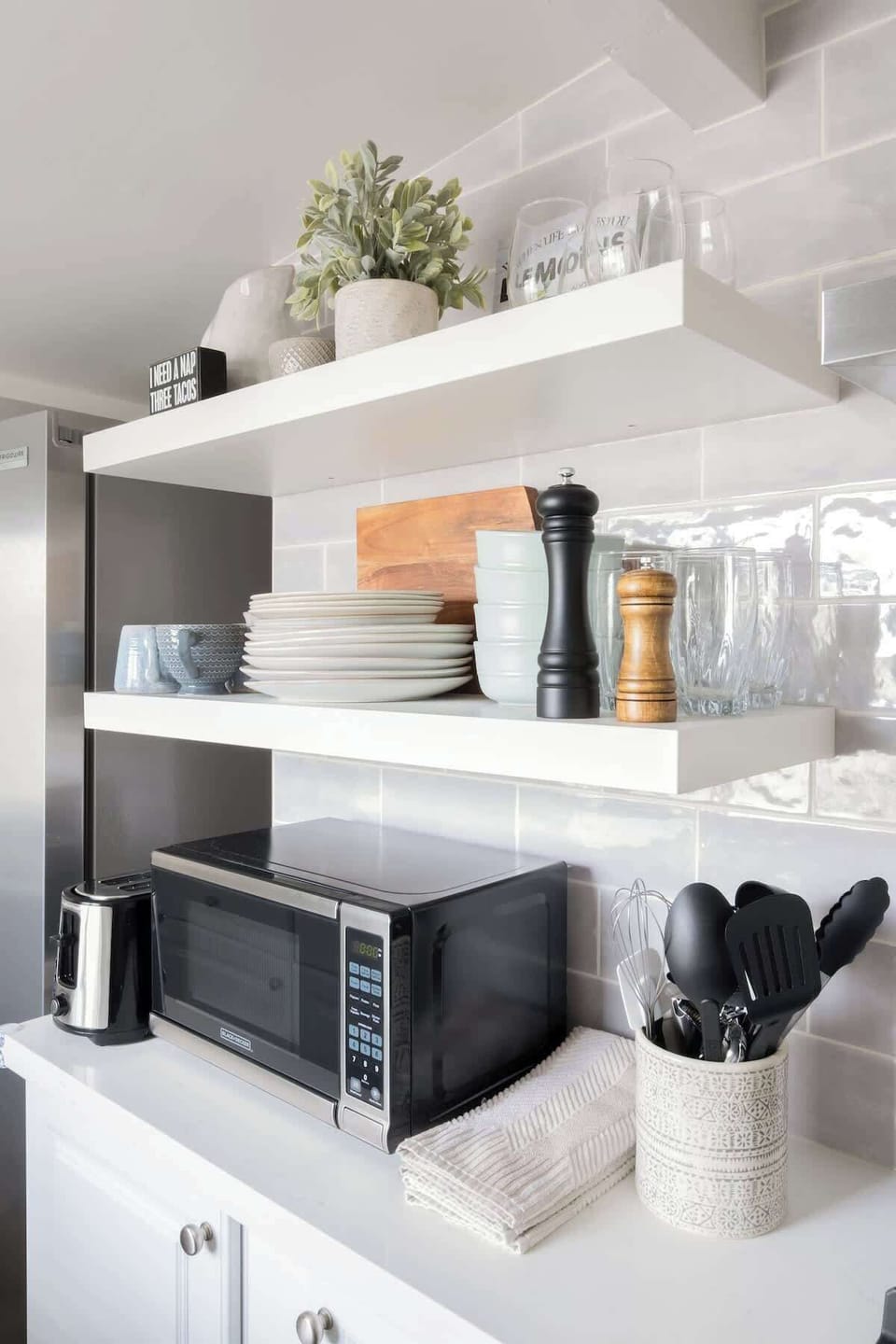 The stylish open shelves come stacked with cooking essentials 