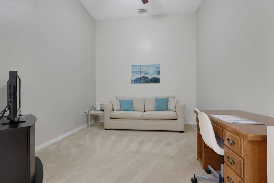 In the open den off the living area you'll find a sleeper sofa, TV and work desk.