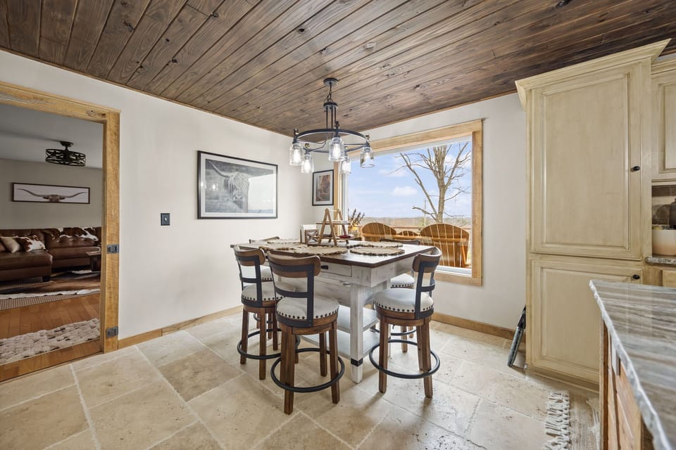 This dining table naturally becomes the heart of shared meals and planning the day ahead.