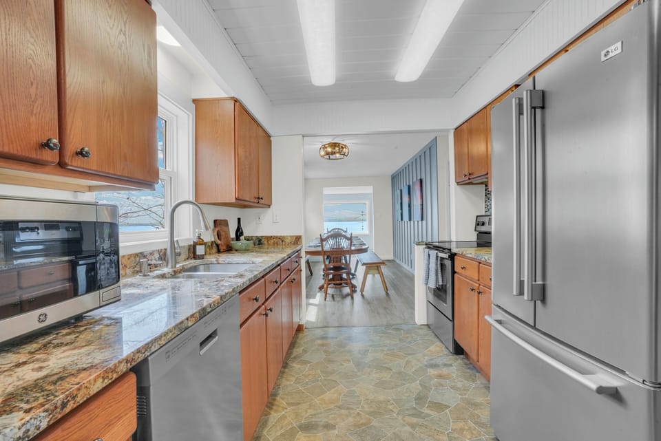 Fully stocked kitchen adjacent to the dining room area