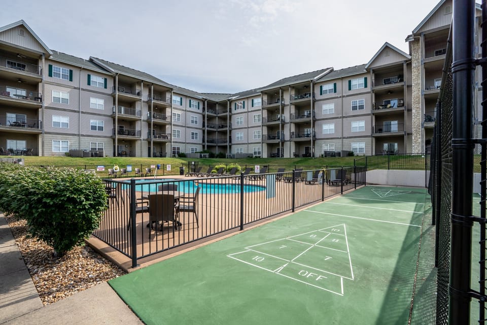 Resort amenities include a seasonal outdoor pool, shuffleboard, playground equipment, and a half-court basketball court.
